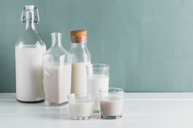 Free photo set of milk bottles and glasses