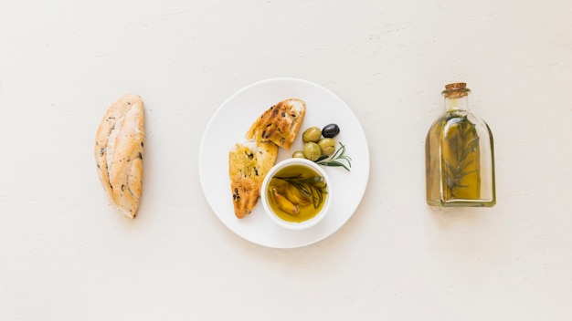 Set of plate with bread oil and olives