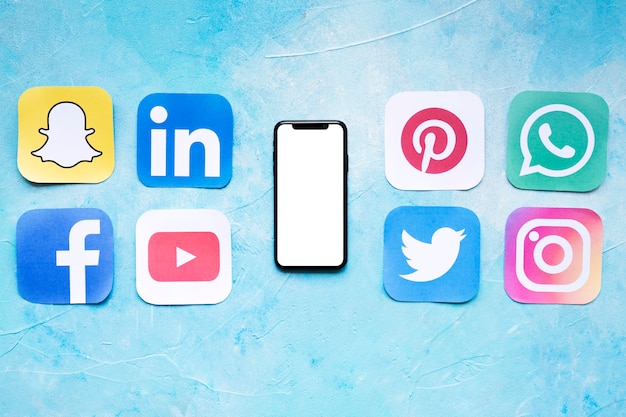 Set of social networking icons placed near smartphone