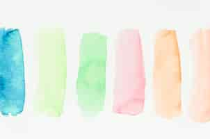 Free photo set of watercolor colorful brush strokes on white background