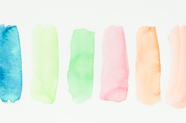 Set of watercolor colorful brush strokes on white background