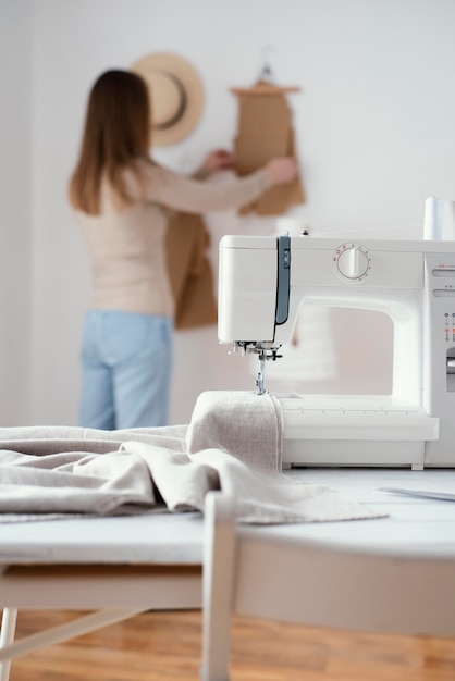 Sewing machine on the table in the tailoring studio