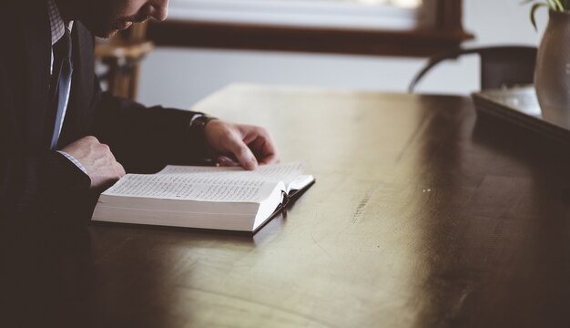 Shallow focus shot of a person reading an Arabic book