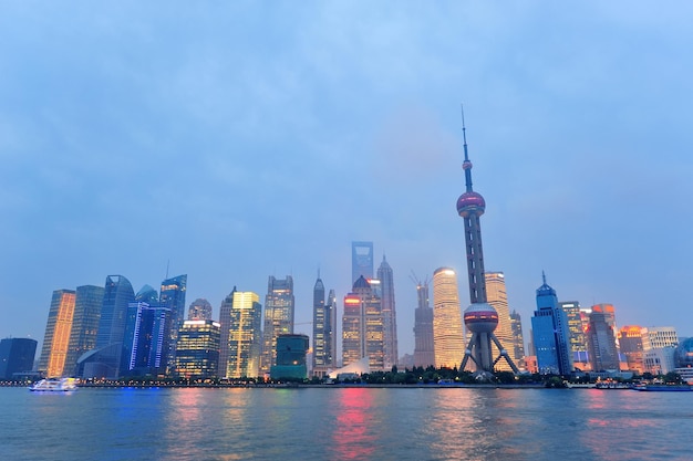 Shanghai city skyline at night over Huangpu river