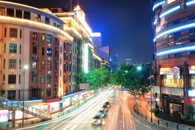 Free photo shanghai street view with urban scene and busy traffic at dusk.