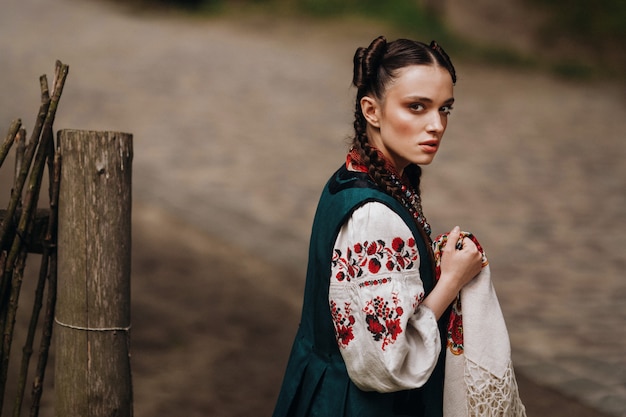 Free Photo сharming girl in the ukrainian traditional dress is walking