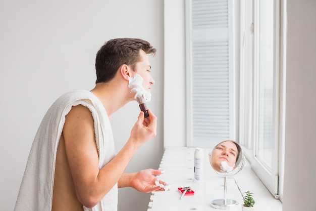 Shaving concept with attractive man