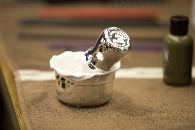 Shaving soap and brush in metal bowl&#xA;