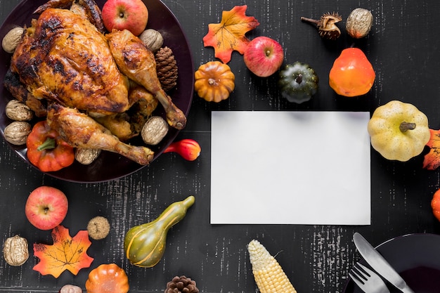 Free photo sheet near roasted chicken, vegetables and fruits