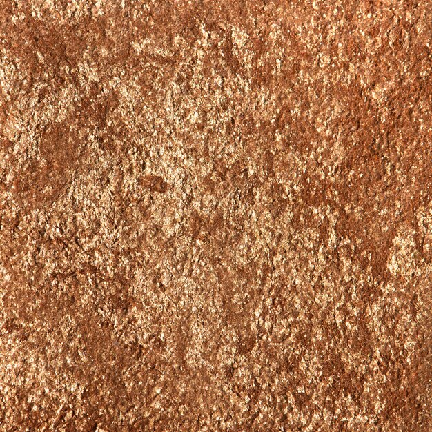 Shiny bronze textured paper background