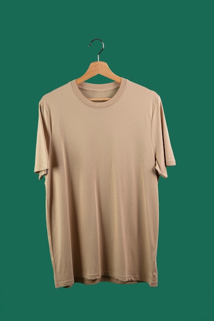 Free Photo shirt on hanger with green background