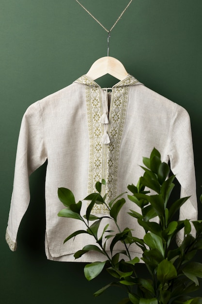 Free photo shirt with green embroidery and plant