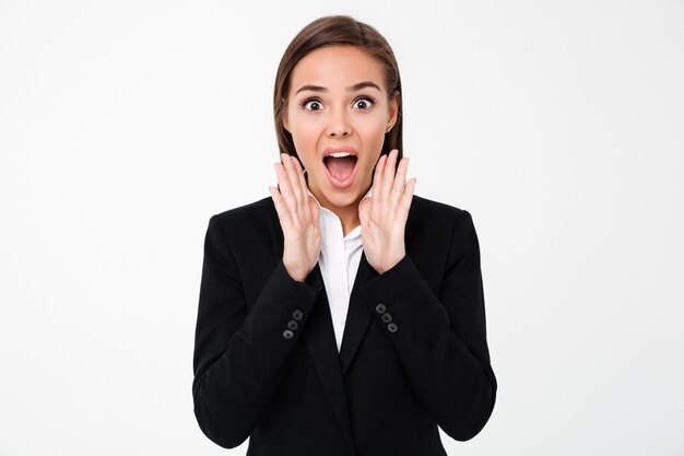 Shocked businesswoman standing isolated