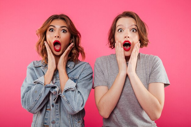 Shocked excited two women friends