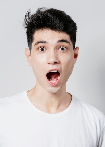 Shocked man posing with mouth open