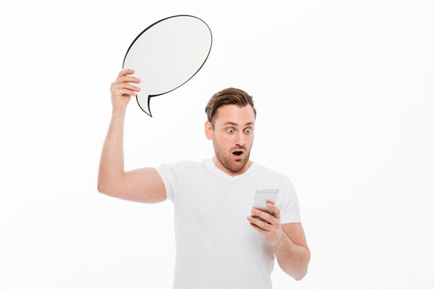 Shocked man standing isolated