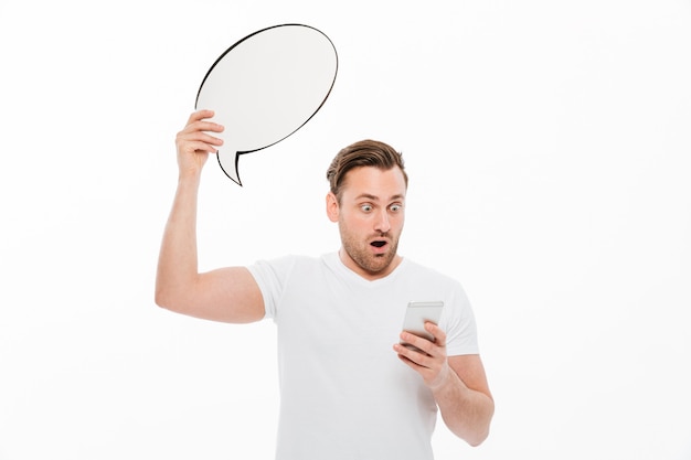 Shocked man standing isolated