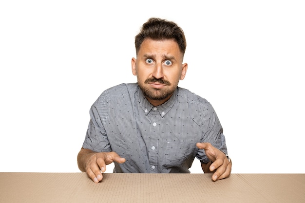 Free Photo shocked and upset man opening the biggest postal package