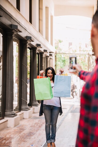 Shopping concept with woman holding bags for photo