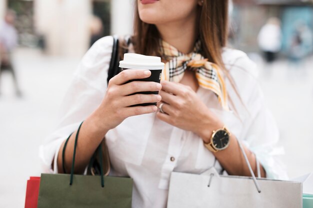 Shopping girl having a coffee