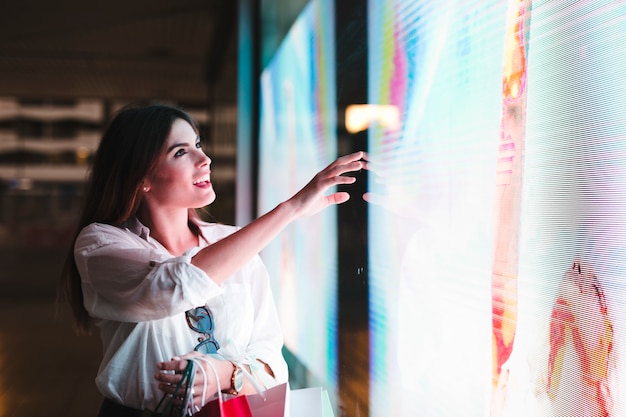 Free photo shopping girl looking at store window