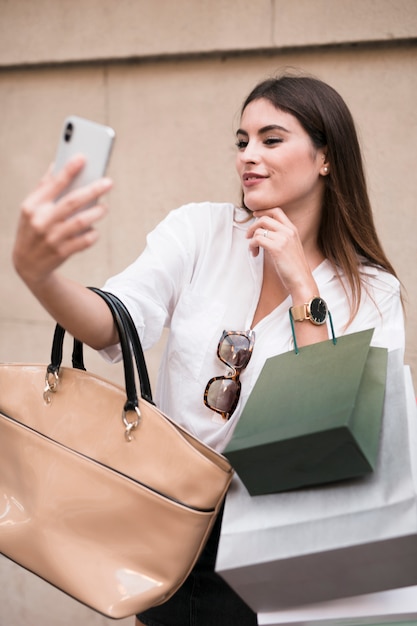 Shopping girl taking a selfie