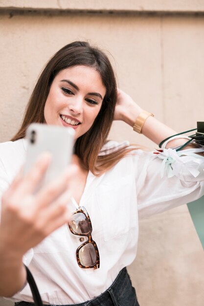 Shopping girl taking a selfie