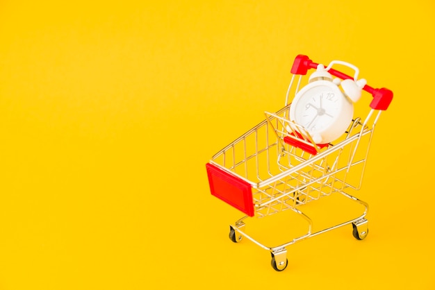 Shopping trolley with little alarm clock 