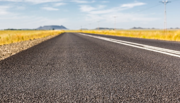 Shot of the asphalt road between fields, South Africa