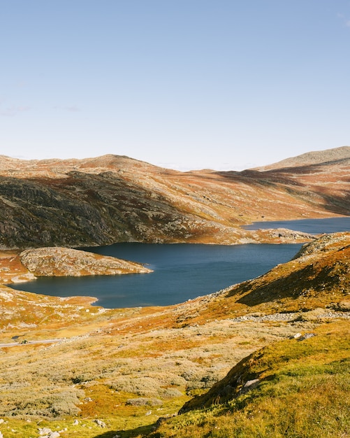 Shot of Bonsnos mountain in Hjartdal, Gausdalen river with lakes, picturesque nature of Norway