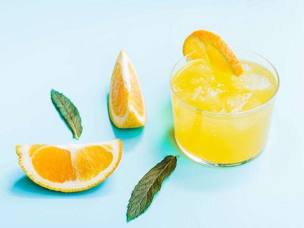 Free photo shot of cold orange drink