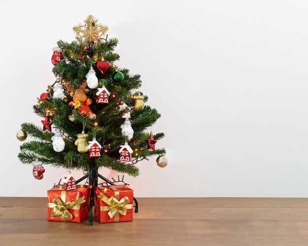 Shot of a decorative Christmas tree with presents under it