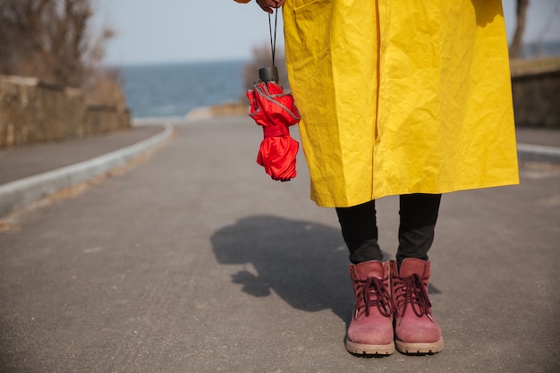 Free photo shot of umbrella and woman legs