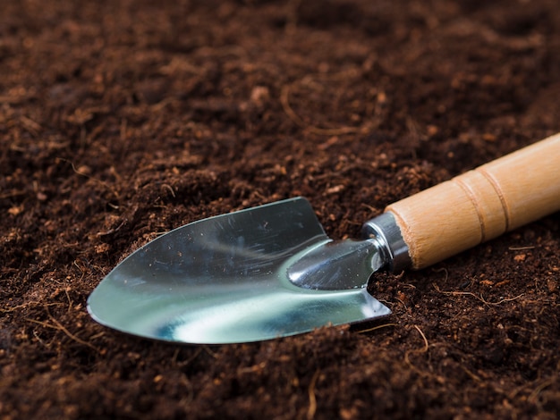 Free photo shovel on soil