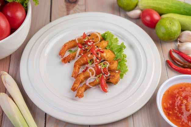 Shrimp deep-fried batter arranged beautifully in a white dish.