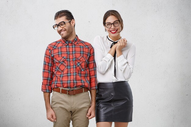 Shy man makes proposal to girlfriend, looks aside as waits for positive answer.