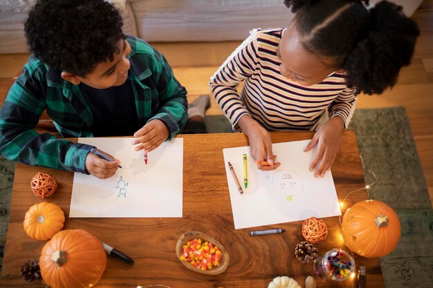 Siblings drawing together before the thanksgiving dinner