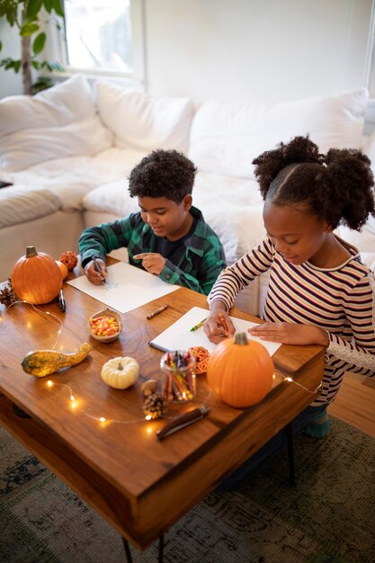 Siblings drawing together before the thanksgiving dinner