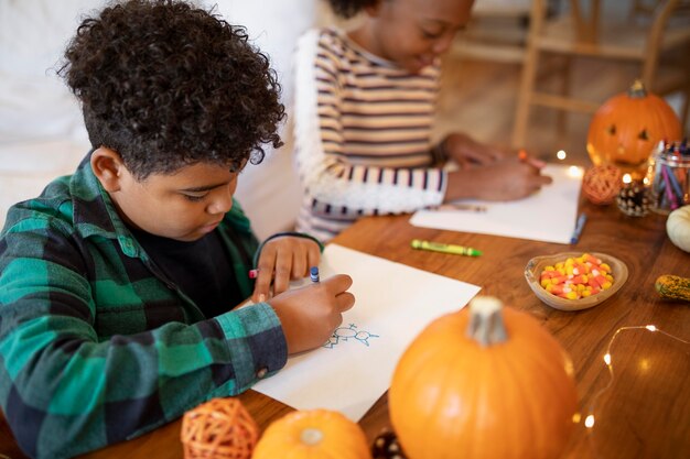 Siblings drawing together before the thanksgiving dinner