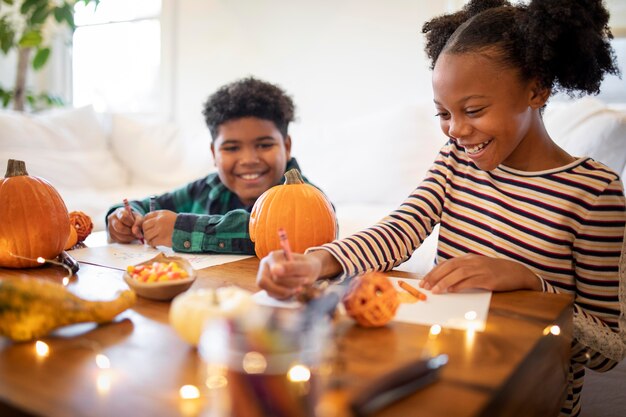 Siblings drawing together before the thanksgiving dinner