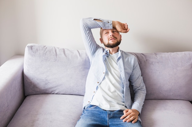 Free photo sick male on couch