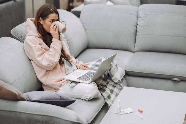 Free photo sick woman with headache sitting at home