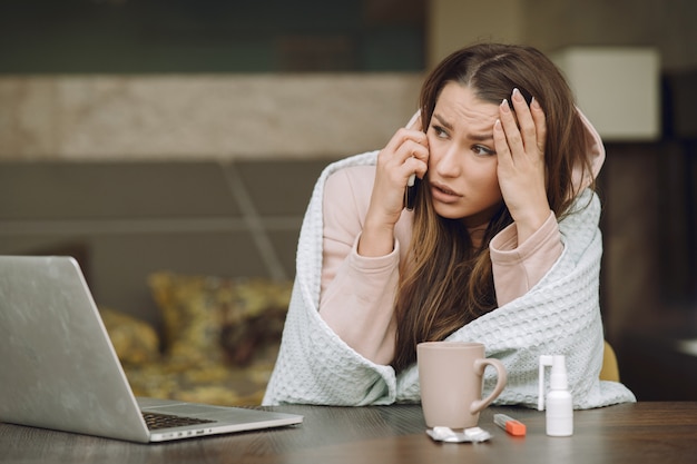 Free photo sick woman with headache sitting at home