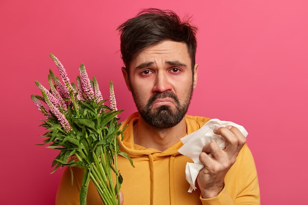 Free Photo sick young man suffering from allergy isolated