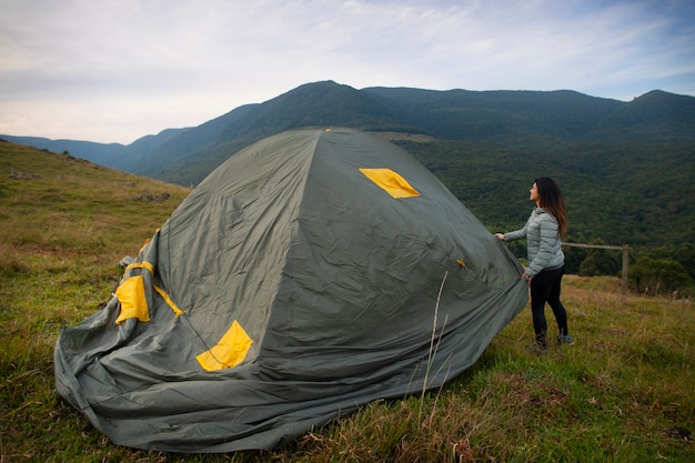 Free Photo side view adventurous woman bivouacking