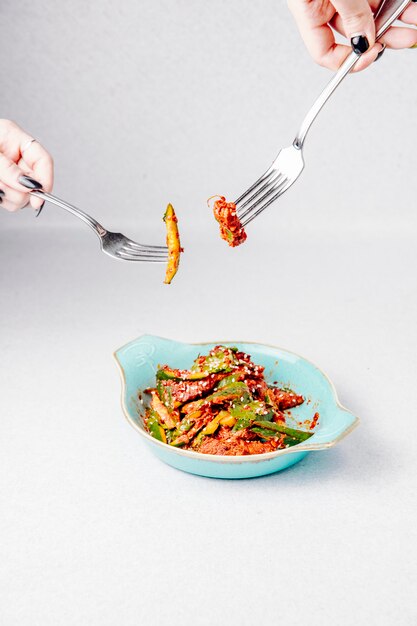 Side view of avocado salad with meat and sesame