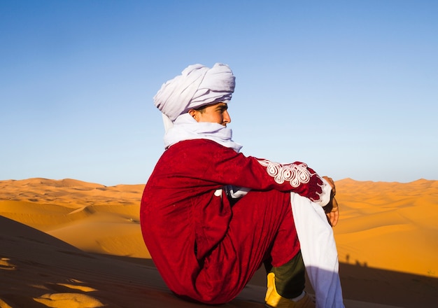 Side view of  bedouin looking in the distance 