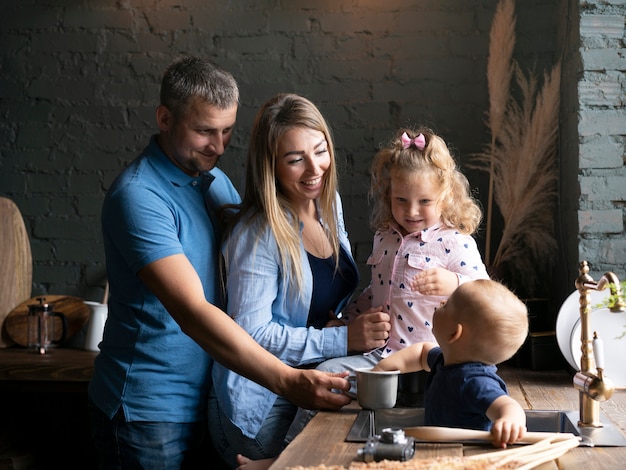 Side view blessed family in the kitchen