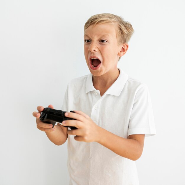 Side view blonde child playing indoors