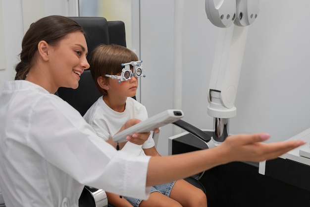 Side view boy at eye's checkup